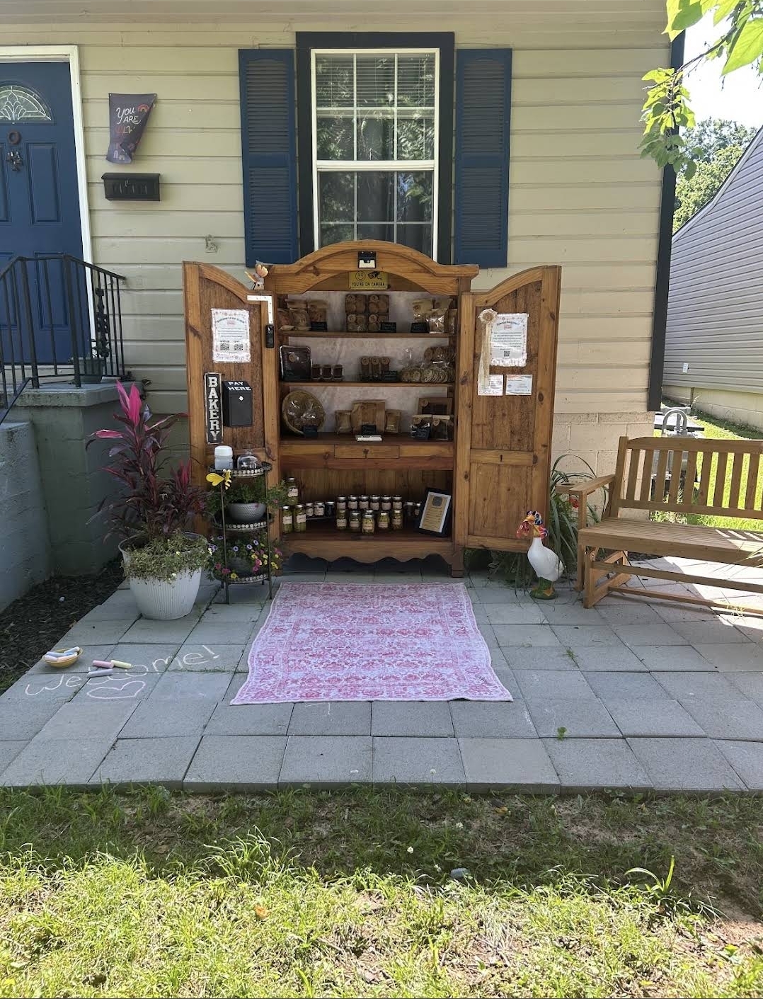 The Casey's Crumb porch bakery cabinet stocked with breads and treats