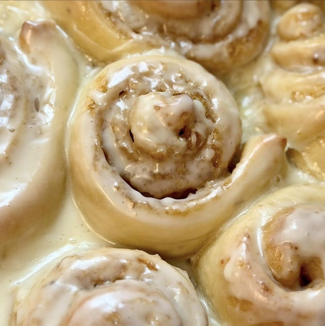 Sourdough cinnamon rolls covered in cream cheese icing