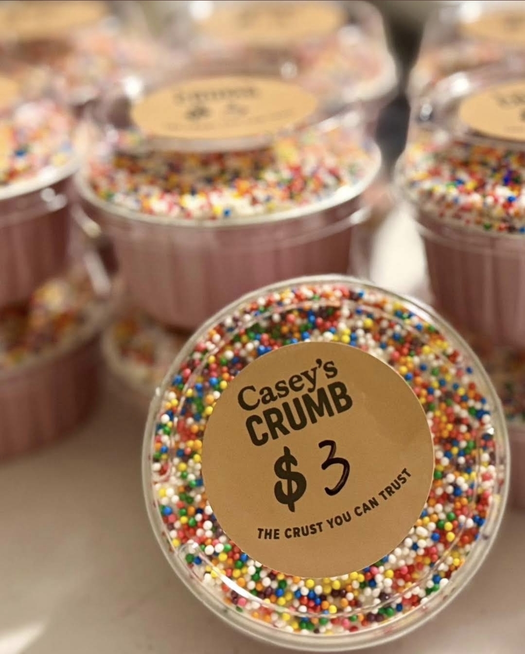 Sprinkle-topped dot cakes with Casey's Crumb labels
